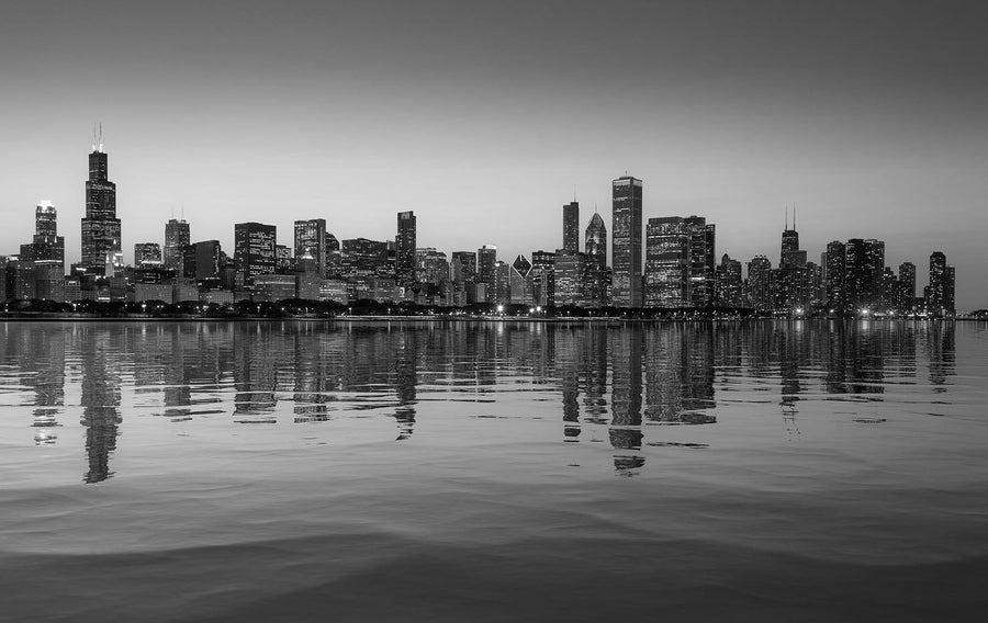 The Chicago Skyline at Sunset From the Observatory Wall Mural captures tall skyscrapers aglow against a transitioning sky, mirrored in Lake Michigan's calm waters, offering perfect inspiration for custom wall murals or peel and stick decor.