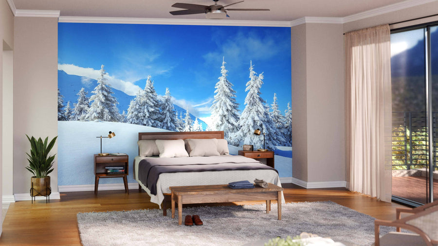A modern living-dining room with wood floors and mid-century furniture is highlighted by the Beautiful Winter Landscape Wall Mural. Soft lighting creates ambiance, and the kitchen appears in the background.