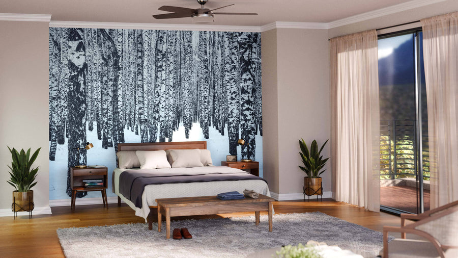 Modern living and dining area with wooden floors, mid-century furniture, cozy seating, dining table, globe pendant lights, natural light from windows, and a large Birch Trees In The Winter Wall Mural creating a wintry forest focal point.