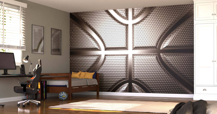 A modern bedroom showcases the Basketball Wall Mural with a close-up texture, yellow and blue pillows, a desk with computer and chair, window blinds, a basketball on the floor, and framed sports artwork for a sporty vibe.