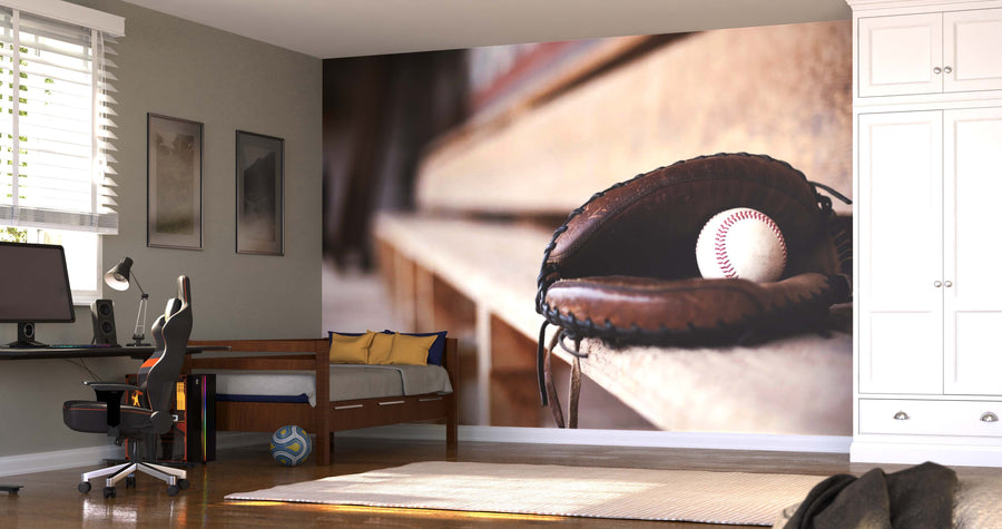 A bedroom features the Catcher's Mitt Wall Mural above the daybed, with a desk, computer, framed pictures, blinds, and a soccer ball on the wooden floor—an ideal backdrop for showcasing removable wallpaper style.