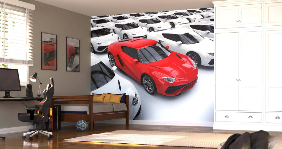 A modern bedroom with a single bed, desk, chair, and wardrobe features the Red Sports Car Wall Mural—a vivid red car among white ones. Sunlight filters through blinds, and a soccer ball is placed on the floor.