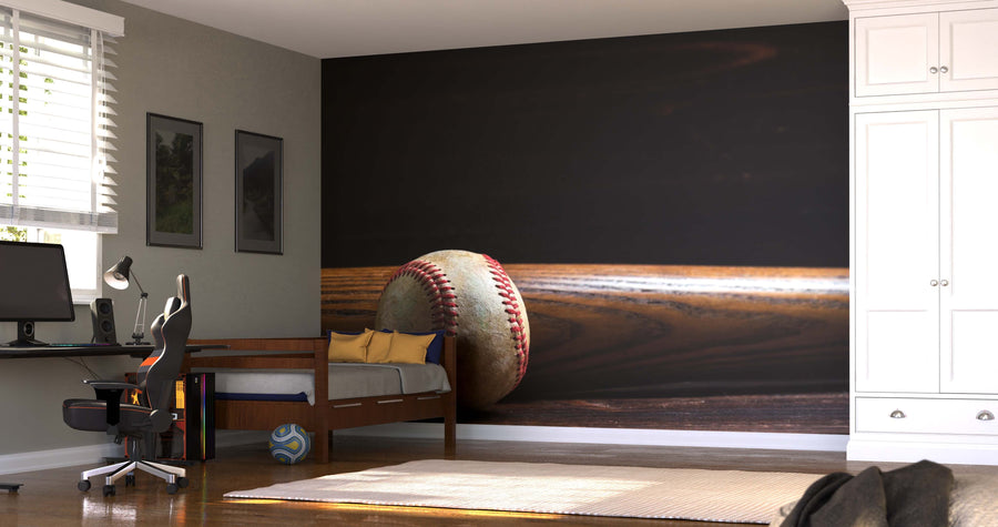 A modern bedroom features the Wooden Baseball Bat and Ball Wall Mural, along with a bed with pillows, a desk with computer and chair, striped rug, and a ball on the floor near the window with blinds.