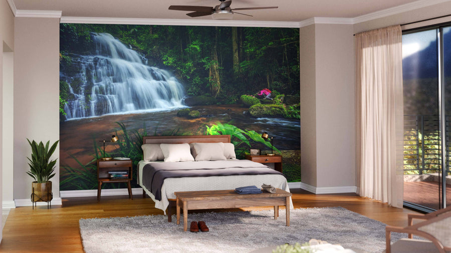 A modern open-concept living and dining room features wood floors, contemporary furniture, and the Breathtaking Waterfalls Wall Mural, bringing a natural, tranquil vibe to the stylish, well-lit interior.