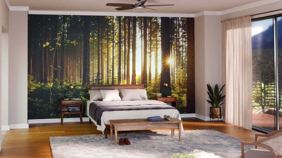 A modern living-dining room with wood floors and mid-century furniture features the Forest in Spring Morning Wall Mural for a serene vibe, enhanced by pendant lights and cozy decor to create an inviting space.