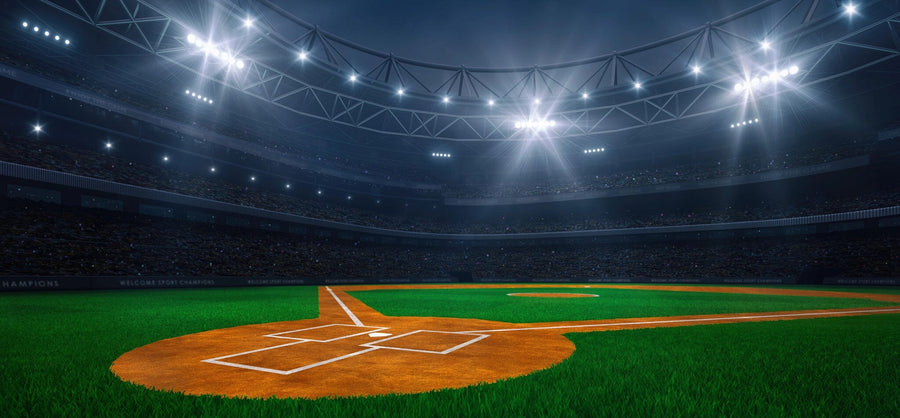 A bedroom showcases the Lit Baseball Stadium Wall Mural. There’s a desk with a chair and computer, a daybed with pillows, a soccer ball on the floor, and sunlight streaming through window blinds.