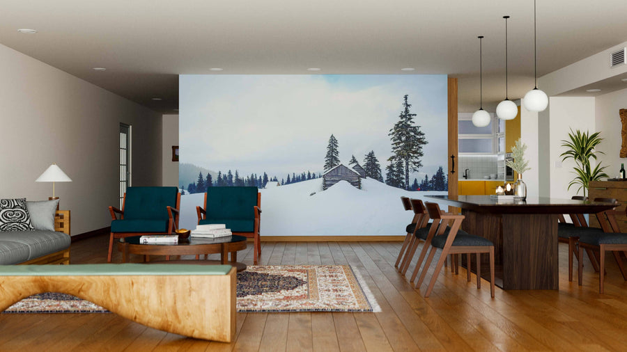 A modern living and dining area with wooden floors, mid-century furniture, and a Wooden Houses on the Hill Wall Mural. Pendant lights illuminate the dining table, while a cozy rug and sofa add warmth to this stylish open space.
