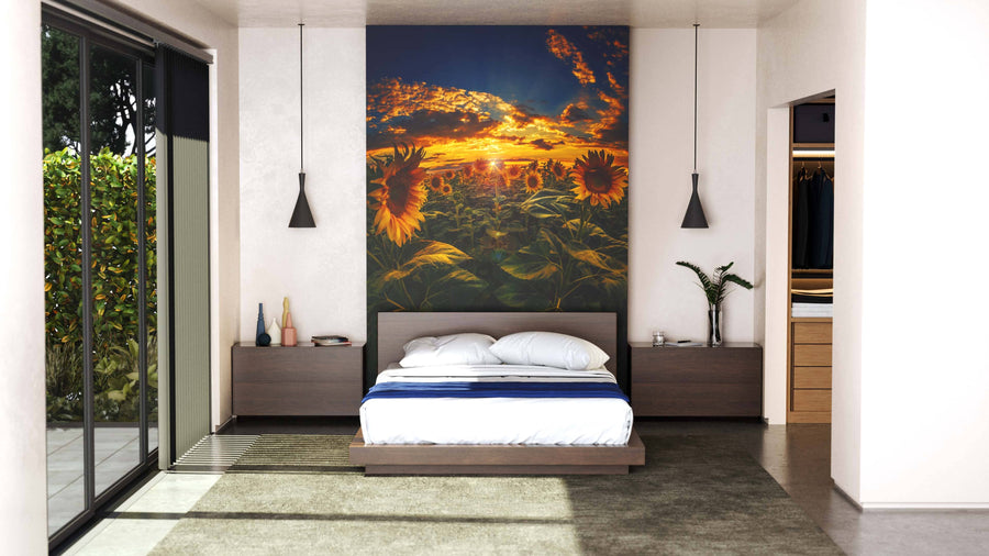 A modern living room with light green walls showcases the "Sunflower Field on Fisheye Lens Wall Mural" on the main wall, complemented by a wooden dining set, sideboard with decor, red rug, houseplants, and large windows with sheer curtains.