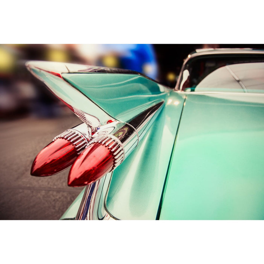 A modern conference room with a long table, black chairs, and glass walls features the Sunday Driver Wall Mural, showcasing a classic green car’s tail fin and red tail lights. Sunlight from the windows brightens the space.