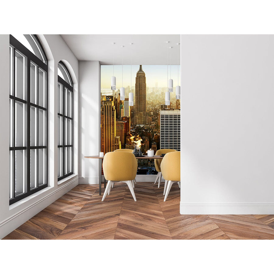 A modern conference room features a long wooden table, black chairs, and large windows. A wall displays the Empire Wall Mural of the Empire State Building and NYC skyline. Another meeting room is visible through glass walls.