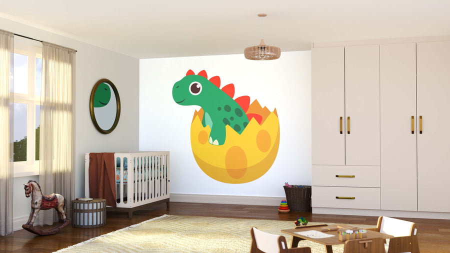 A bright, modern nursery features the Adorable Dino Wall Mural—a cartoon green dinosaur hatching from a yellow egg—alongside a crib, rocking horse, toys, rug, round mirror, and sunlight through sheer curtains.