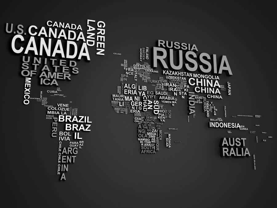 The "Nations in Text" wall mural by Deposit Photo features a stylized world map with country names as text. Large countries like Canada, Russia, China, Brazil, the USA, and Australia stand out in bold colors on a dark maroon backdrop. Easily customize your space with this removable wallpaper.