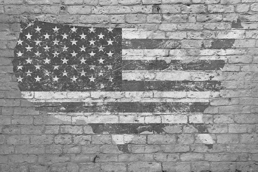 The USA Flag Brick Art Wall Mural features a weathered United States map with an American flag design on a gray brick wall, offering rustic style—perfect as custom printed mural or removable wallpaper for your space.