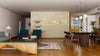 A modern living-dining room with wood flooring, teal armchairs, a gray sofa, wooden dining table, pendant lights, houseplants, and a Balanced Zen Stones Wall Mural. The kitchen is visible in the back.