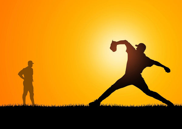 Capture the energy of the game with the Baseball Player Training Wall Mural—featuring two player silhouettes at sunset, with bold orange-yellow skies and grassy field. This durable peel and stick mural adds vibrant sports style to any room.