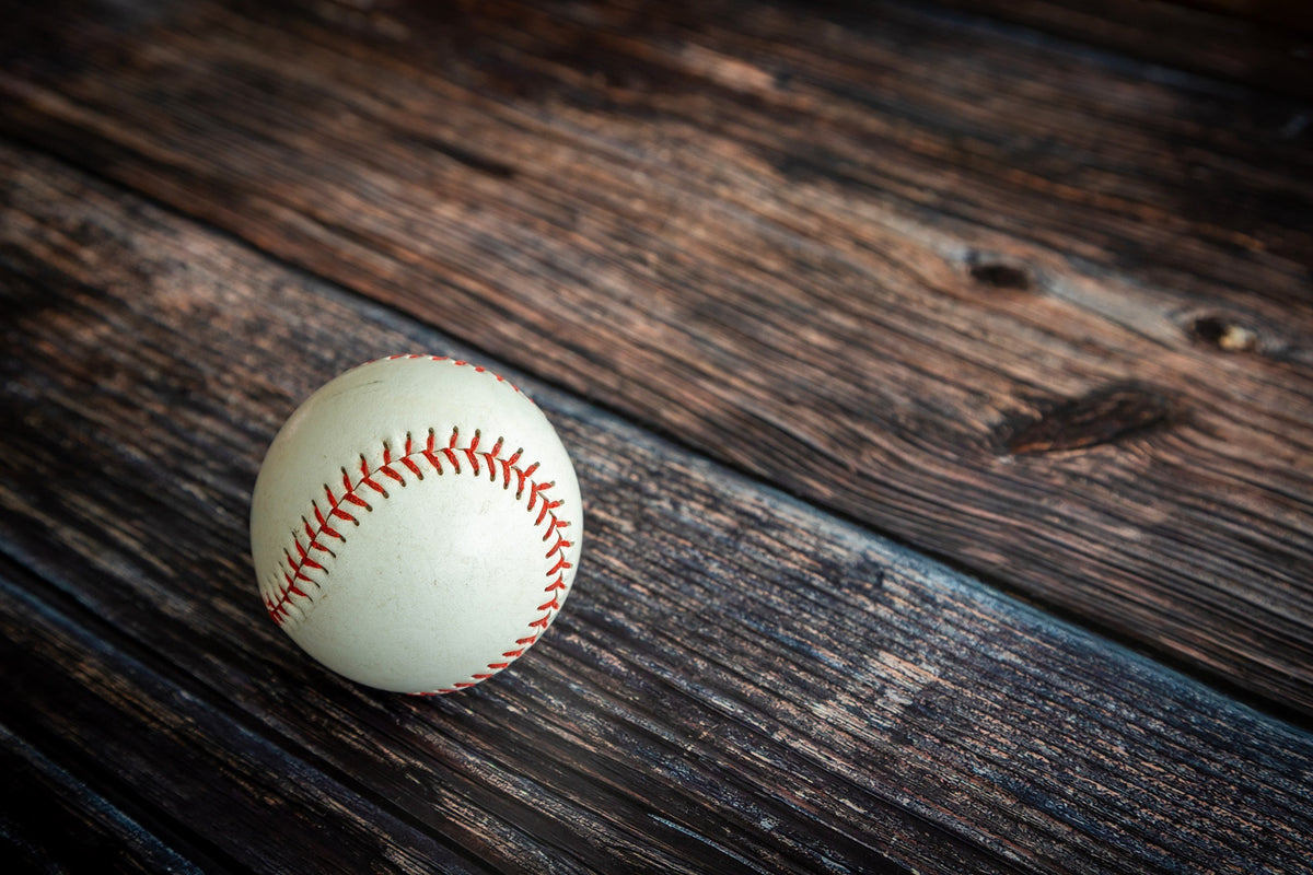 Baseball on weathered wooden surface – Peel and Stick Wall Murals