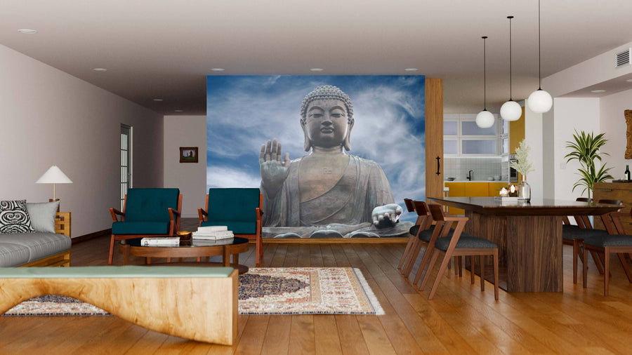 A modern living-dining room showcases wood floors, mid-century furniture, and the Big Buddha Wall Mural featuring a peaceful Buddha against clouds, serving as a serene focal point that blends contemporary and natural styles.