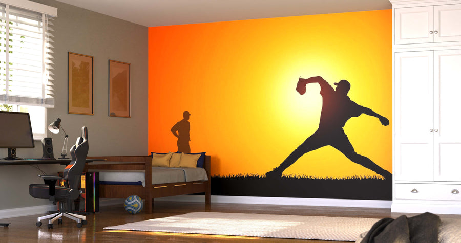 A modern bedroom features the Baseball Player Training Wall Mural, depicting two baseball player silhouettes at sunset. Light filters through blinds, complementing the computer desk, single bed, and white wardrobe for a personalized look.