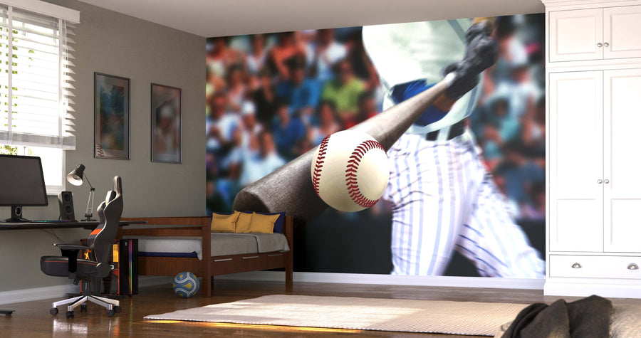 A modern bedroom with a desk, office chair, daybed, white cabinets, and sunlight streaming in. The wall features the Game-Changing Swing Wall Mural of a baseball player at bat. A soccer ball rests by the bed.