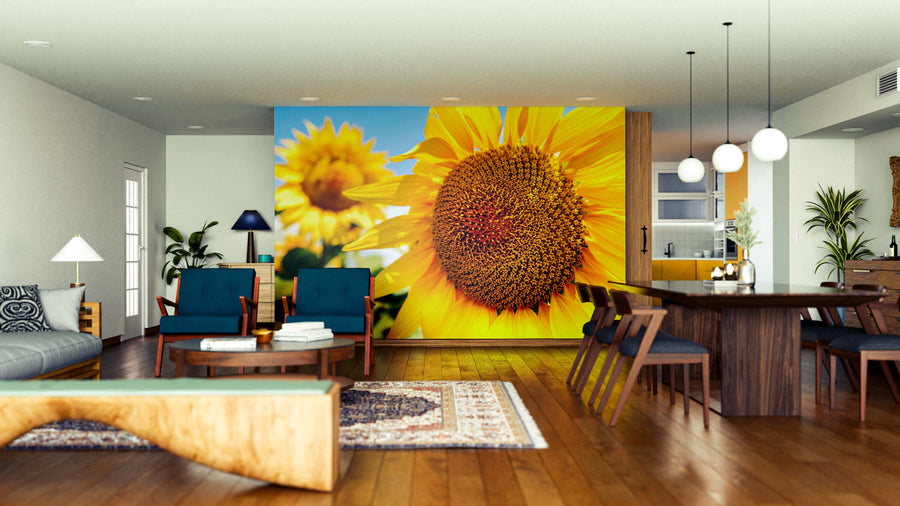 Modern open-concept living and dining room with wood floors, stylish furniture, and pendant lights. The Bright and Bold Wall Mural adds a cheerful touch, while a cozy rug and houseplants bring extra warmth to the inviting space.