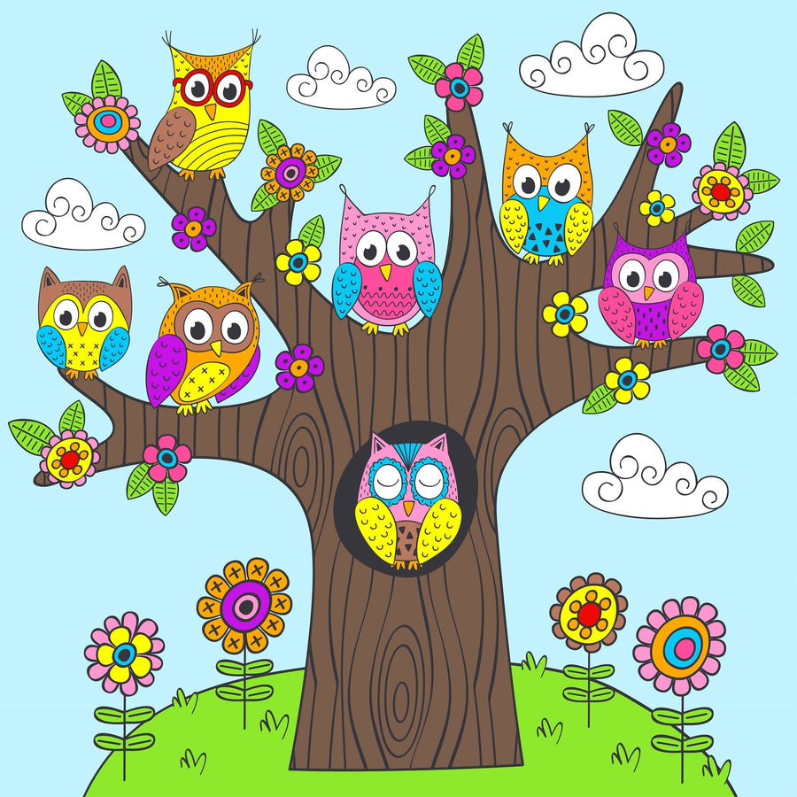 A cozy nursery features a crib, soft beige curtains, a rattan light fixture, and the Bright and Playful Owls Wall Mural with cartoon owls, flowers, and clouds. Wooden toys and storage baskets add charm to this cheerful room.