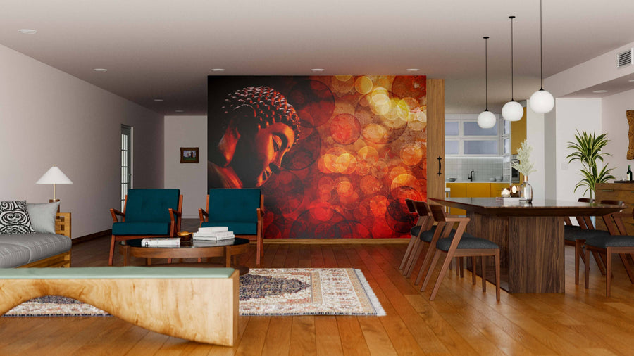 A modern living and dining room with wooden floors, teal armchairs, a gray sofa, a Bronze Red Zen Buddha Statue Wall Mural in warm tones, a wooden dining set, pendant lights, and an open kitchen in the background.