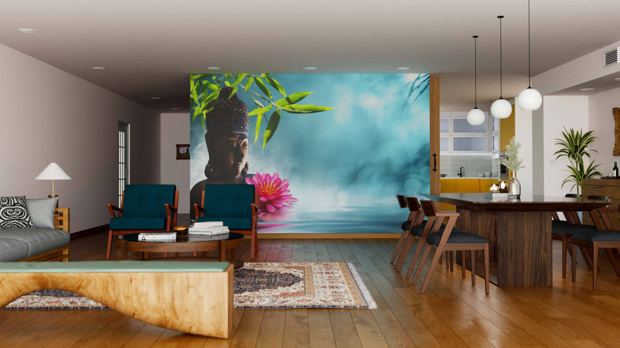 A modern open-plan living and dining room with wood floors, teal chairs, a large table, and the “Buddha in Meditation Wall Mural” featuring a serene Buddha, bamboo, and lotus on a misty blue background. Contemporary lights hang above.