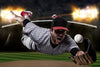 The Catching Baseball Wall Mural shows a player in a gray pinstripe uniform and black cap diving on a night field, arm outstretched with glove to catch the ball. Bright stadium lights illuminate the dramatic canvas-textured scene.