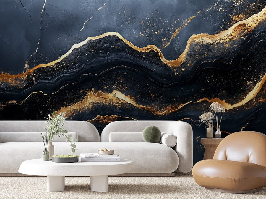 A modern living room features the Celestial Rift Wall Mural, showcasing a black and gold marble pattern. The space includes two white sofas, a white oval coffee table adorned with plants and decor, a brown leather chair, and is warmed by a textured beige carpet on the floor.