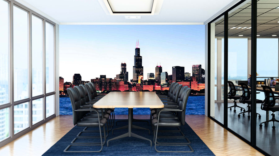 A modern conference room with a long wooden table, black chairs, and floor-to-ceiling windows features a glass wall and the Chicago Dark Night Time Panorama Wall Mural, adding sophistication to the bright, open space.