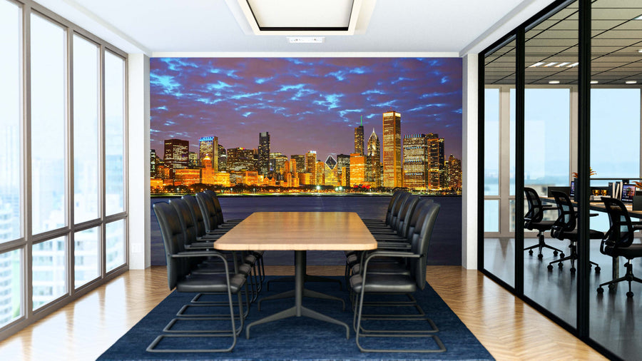 Modern conference room featuring a long wooden table, black chairs, and floor-to-ceiling windows. The back wall displays the Chicago Golden City Wall Mural. An adjacent similarly furnished room is visible through glass walls.