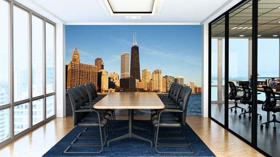 A modern conference room with a long wooden table, black chairs, glass walls, and a large “Chicago Morning On Hancock Building Wall Mural.” Another office with similar furniture is visible through the glass wall.