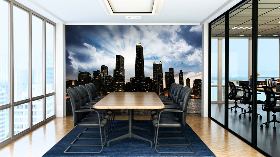 A modern conference room with a long wooden table, black chairs, and glass walls features the Chicago Skyline at Sunset Wall Mural. Natural light from large windows on the left highlights this dramatic mural on the far wall.
