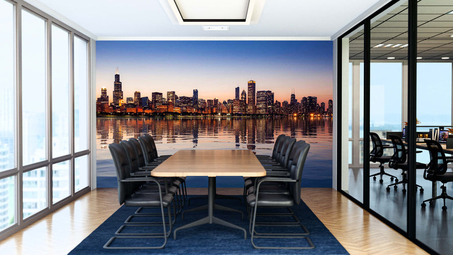 A modern conference room features a long wooden table, ten black chairs, floor-to-ceiling windows, and the "Chicago Skyline at Sunset From the Observatory Wall Mural." Glass walls reveal an adjacent office space with a similar design.