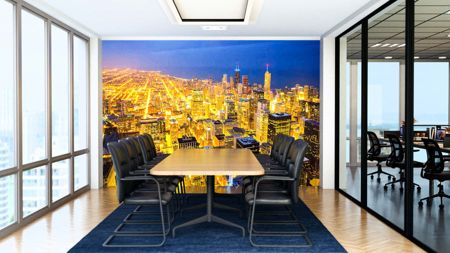 A modern conference room features a long wooden table, black chairs, and the “Chicago Gleaming Streets at Dusk Wall Mural” showing the city at night. Glass walls reveal another office with similar decor.