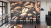 A modern cafe with high tables, stools, industrial lighting, and bar seats by large windows features the Aromatic Coffee Beans Wall Mural on the back wall, adding cozy warmth and style with its rich brown coffee bean design.