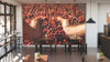A modern café with wooden tables, stools, small potted plants, and the Harvest in Hand Wall Mural depicting hands holding coffee cherries. Bright natural light streams in from large windows on the left.