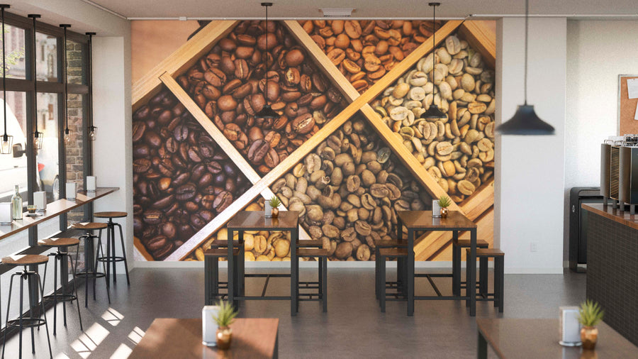 Modern café with a large Roast Level Showcase Wall Mural featuring coffee beans in wooden crates. Seating includes high stools at window counters, black tables with wooden chairs, potted plants on tables, and pendant lights above.