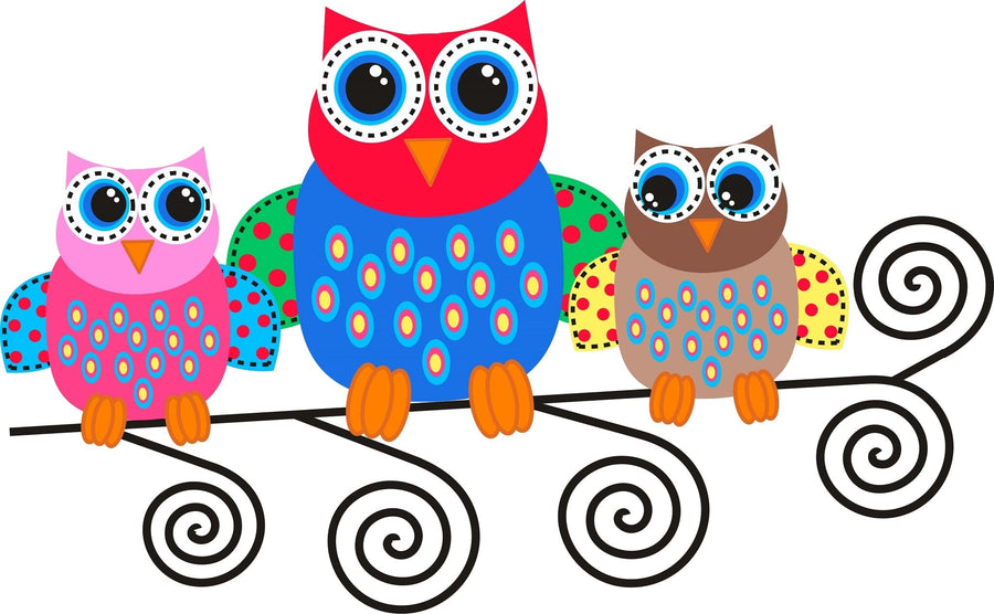 A nursery room with a crib, dresser, and houseplant. Above the crib, the Colorful Owls Wall Mural—a peel and stick design featuring three cartoon owls on a branch—adds charm. Framed pictures and plush toys complete the playful decor.