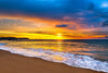 A vibrant sunset over the deep blue sea – Peel and Stick Wall Murals