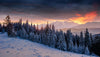 Snowy mountain landscape with trees and snow under a colorful sunset – Peel and Stick Wall Murals