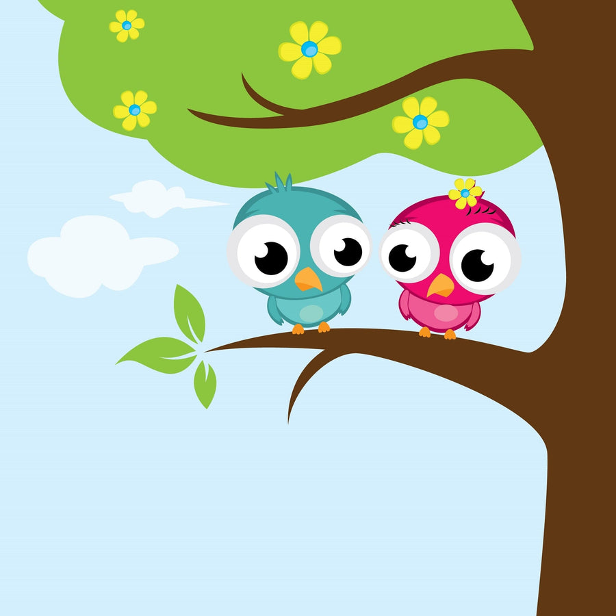 A nursery with a crib, ottoman, rug, toys, and mirror. The wall displays the Cute Love Birds Wall Mural featuring two cartoon owls—one blue, one pink—on a leafy branch with yellow flowers as sunlight streams in.