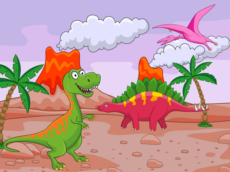 A nursery with wooden floors and white furniture features the Dino Day Wall Mural—a colorful peel and stick design of cartoon dinosaurs, palm trees, and mountains beneath a pink and purple sky. Shelves, plants, and photo frames decorate the right side.