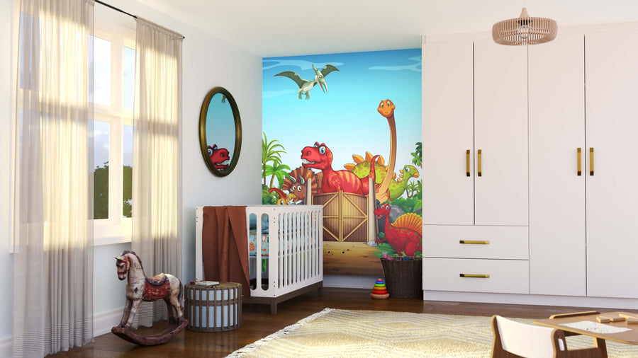 A nursery with light walls and wooden floor features a crib beside the Dino Land Wall Mural with cartoon dinosaurs and a pterodactyl. The room includes a rocking horse, round basket, oval mirror, white wardrobe, and sunlight through sheer curtains.