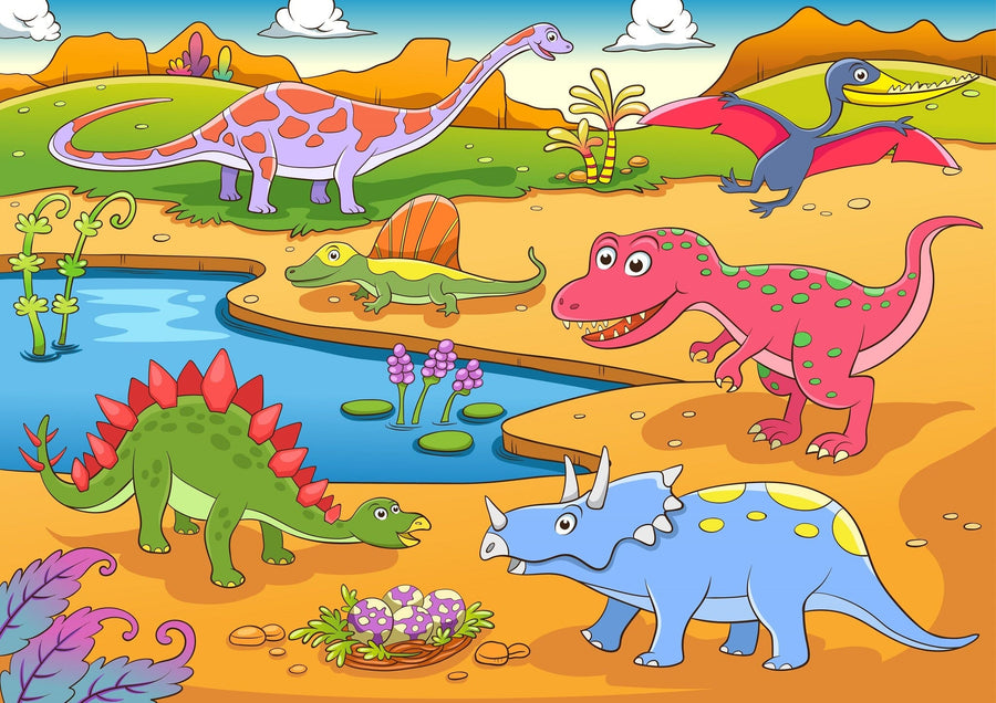 A nursery room with the Dino Valley Wall Mural, a colorful peel and stick mural featuring cartoon dinosaurs and a prehistoric landscape. The room has a white crib, dresser with baby items, wooden flooring, potted plant, and plush toy.