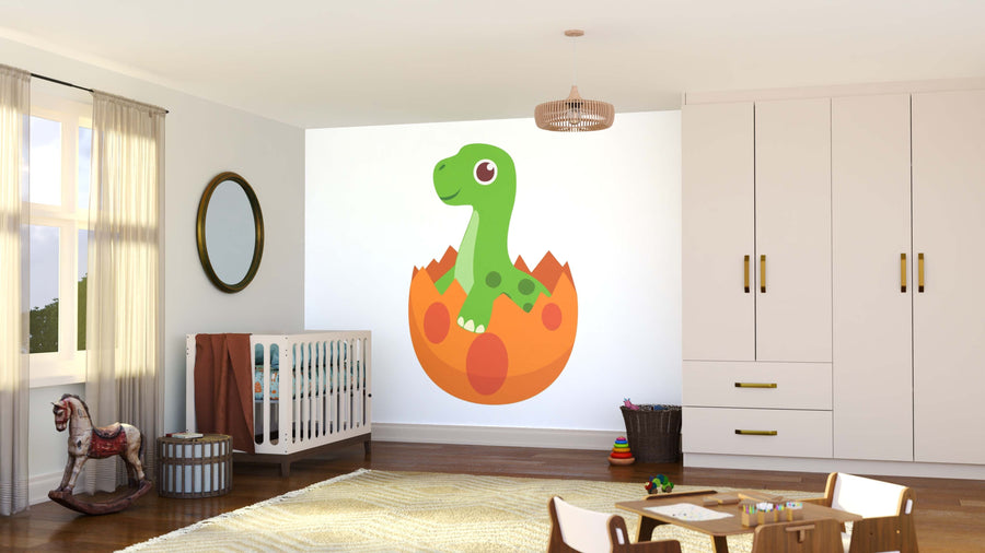 A nursery room with a crib, toy horse, storage basket, soft rug, toys, window with curtains, white cabinets with gold handles, and a large Dinosaur Egg Wall Mural featuring a smiling green cartoon dinosaur hatching from an orange egg.
