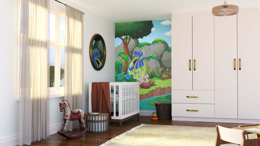 A bright nursery features a crib, wicker baskets, a wooden rocking horse, and a large wardrobe. The Dragon Hatch Wall Mural displays a blue cartoon dragon in a green forest. Sunlight filters through sheer curtains on the left window.