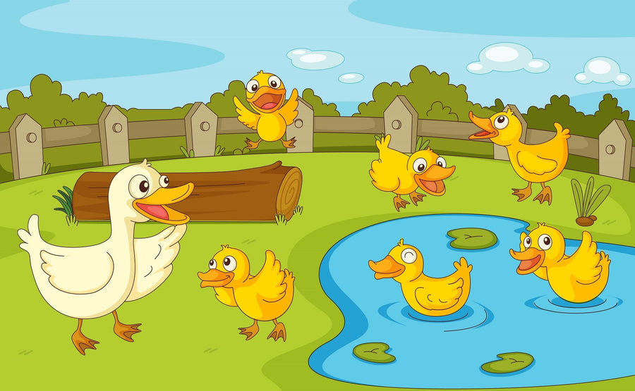 A nursery with a crib, rocking horse, and chairs features the Ducklings at Play Wall Mural—large, colorful, and peel-and-stick—showing cartoon ducks by a pond, fence, green grass, trees, and sky. Sunlight streams through a window with blue curtains.