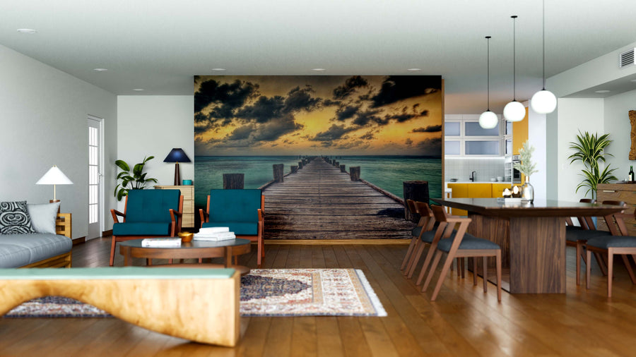 A modern living-dining area features wooden floors, teal chairs, a wooden dining table, and the Edge of Calm Wall Mural as a focal point. Pendant lights, plants, and eclectic decor complete this stylish open space.