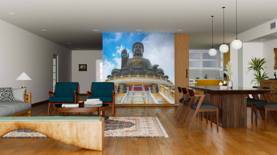 Modern living-dining room with wooden floors, chic furniture, and globe pendant lights features the Giant Buddha of Hong Kong Wall Mural, showcasing a majestic outdoor Buddha statue beneath a blue sky for a serene, cultural accent.